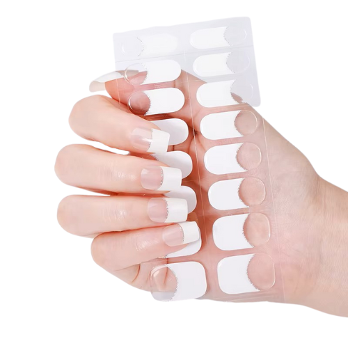 Hand wearing white tip nail wraps on a white background by Stellia Beauty