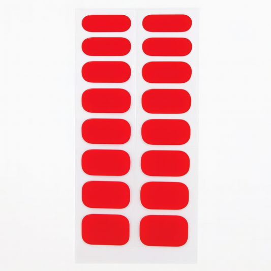 Sheet of red gel nail wraps on a white background by Stellia Beauty