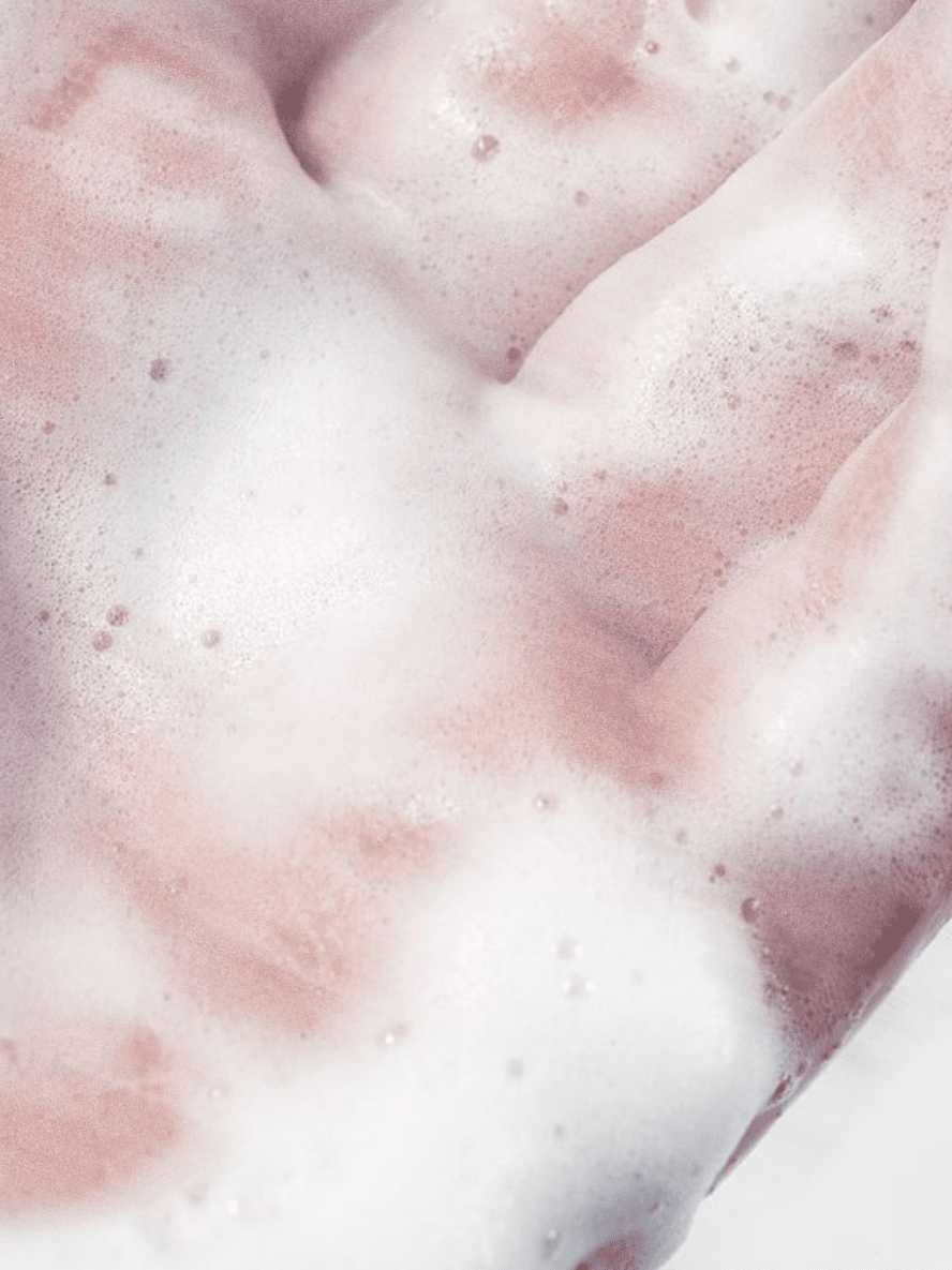 Close-up of pink and white foamy texture Vegan Moisturising Conditioner | BYMANYC ® New York Stellia Beauty