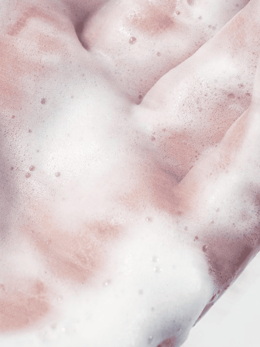 Close-up of pink and white foamy texture Vegan Moisturising Conditioner | BYMANYC ® New York Stellia Beauty