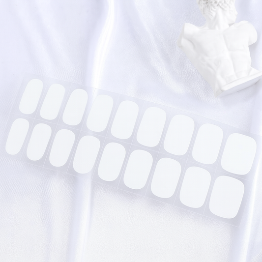 Set of white gel nail wraps on a white background by Stellia Beauty