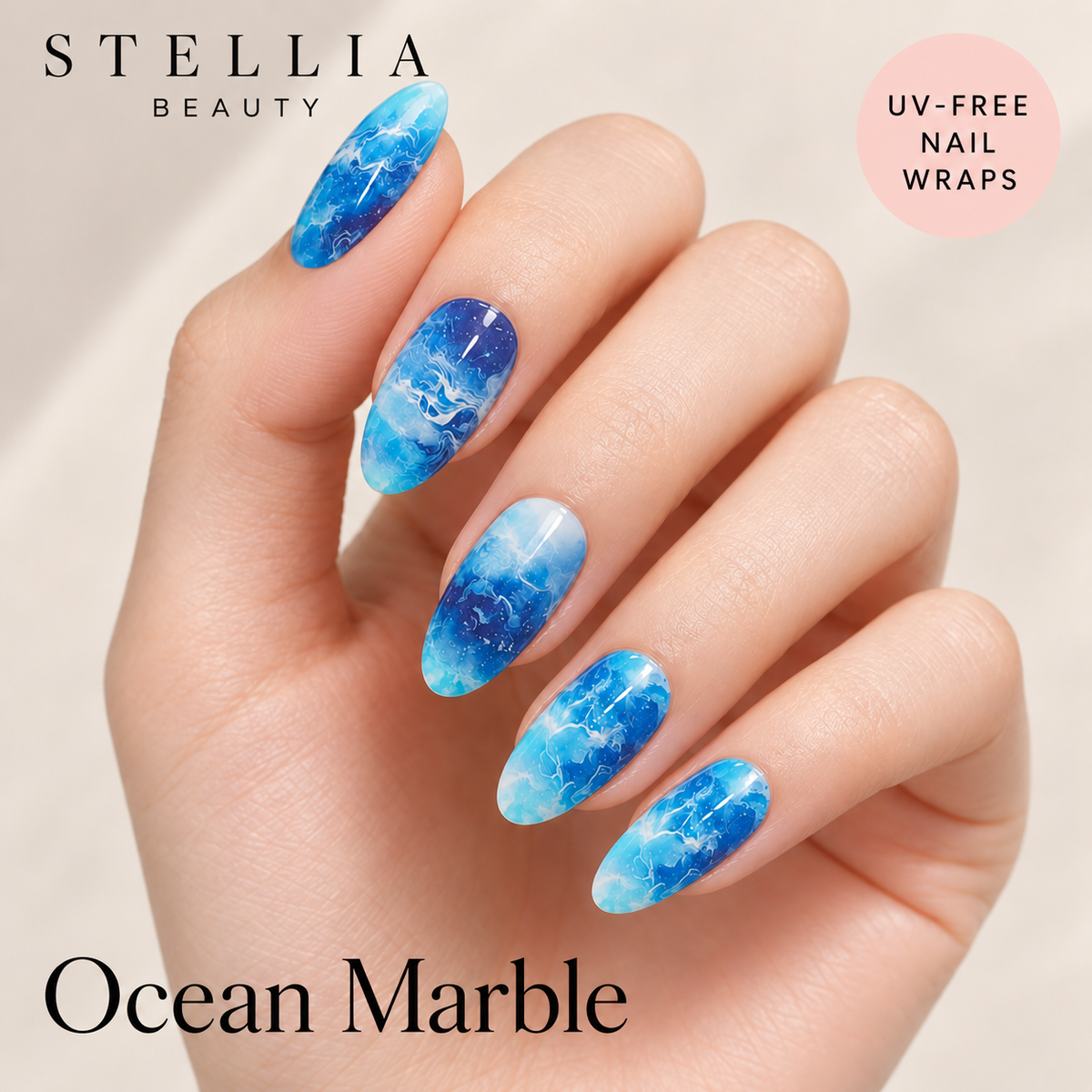 Stellia Beauty Ocean Marble nail wraps on manicured hands with blue and white marble pattern.