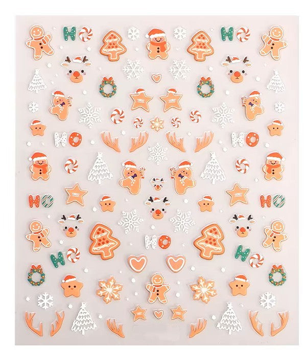 Sheet of Christmas-themed nail art stickers featuring gingerbread men, reindeer, candy canes, snowflakes, stars, and festive holiday cookie designs by Stellia Beauty