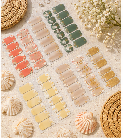 Stellia Beauty nail wraps arranged in neutral, floral and green designs