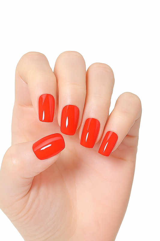 Hand with bright red semi cured gel nail wraps on a white background by Stellia Beauty