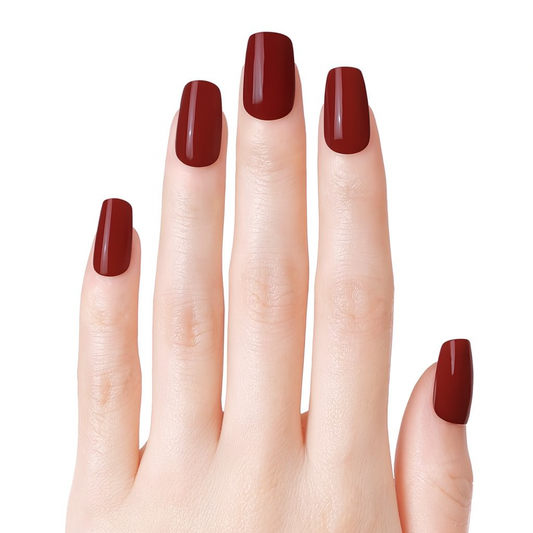 hand showing burgundy gel nail wraps by Stellia Beauty