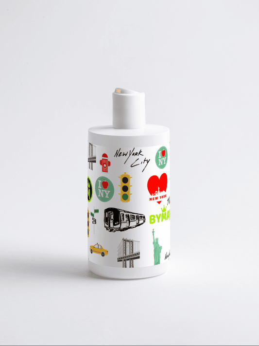 White bottle with New York City-themed decorations on a white background Cocktail Conditioner – BYMANYC ® New York | Vegan Haircare Stellia Beauty
