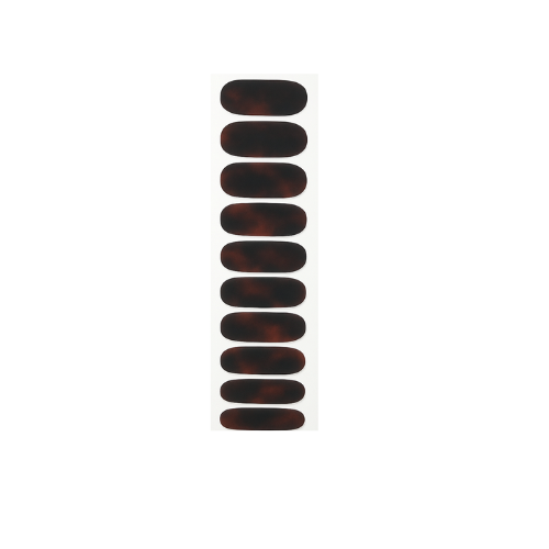 Set of dark tortoiseshell nail wraps on a white background by Stellia Beauty