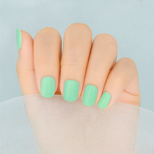 Hand showing Mint Green Nail Wraps by Stellia Beauty