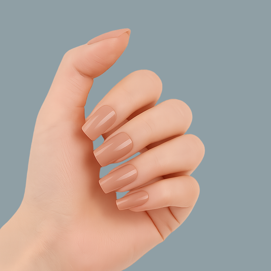 Hand with nude semi cured gel nail wraps on a white background by Stellia Beauty