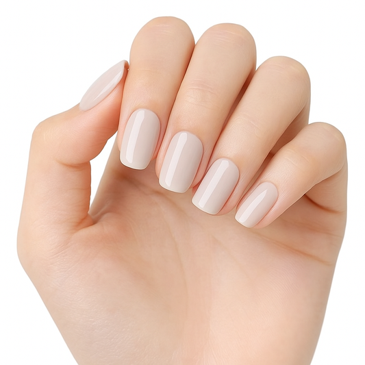 Hand with nude beige semi cured gel nail wraps on a white background by Stellia Beauty