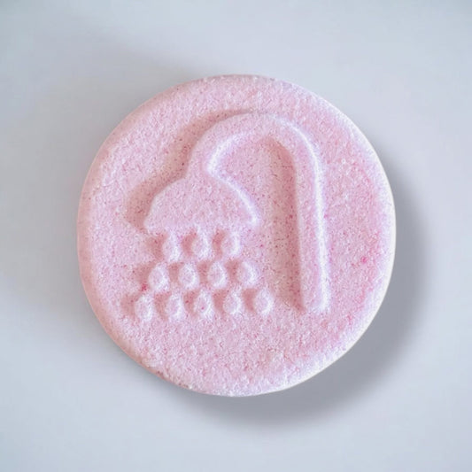 Pink shower foamer on a white background