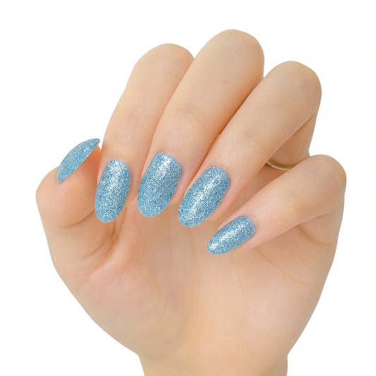 hand with Sky blue glitter nail wraps by Stellia Beauty