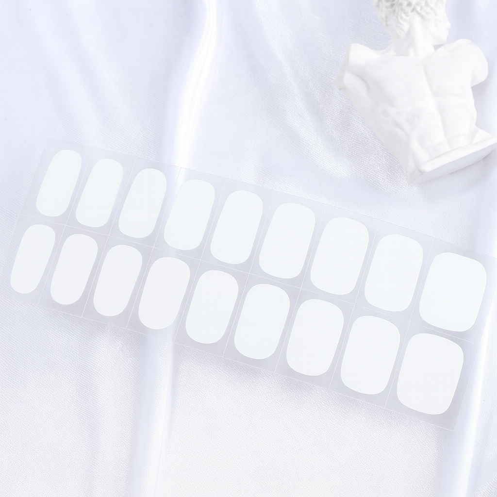 Set of white gel nail wraps on a white background by Stellia Beauty