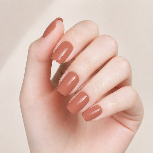 Elegant Nude Gel Nail Wraps – Long-Lasting, Easy Application, Salon-Quality Finish manicure on hand – Stellia Beauty