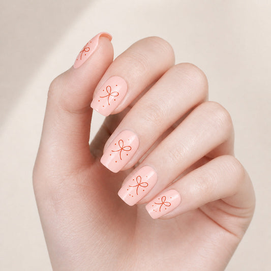 Pink Bows Gel Nail Wraps – Fully Cured, No UV Light Required manicure on hand – Stellia Beauty