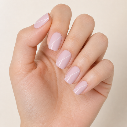 Stellia Beauty Blush Line nail wraps on a blush pink with fine white diagonal lines manicure