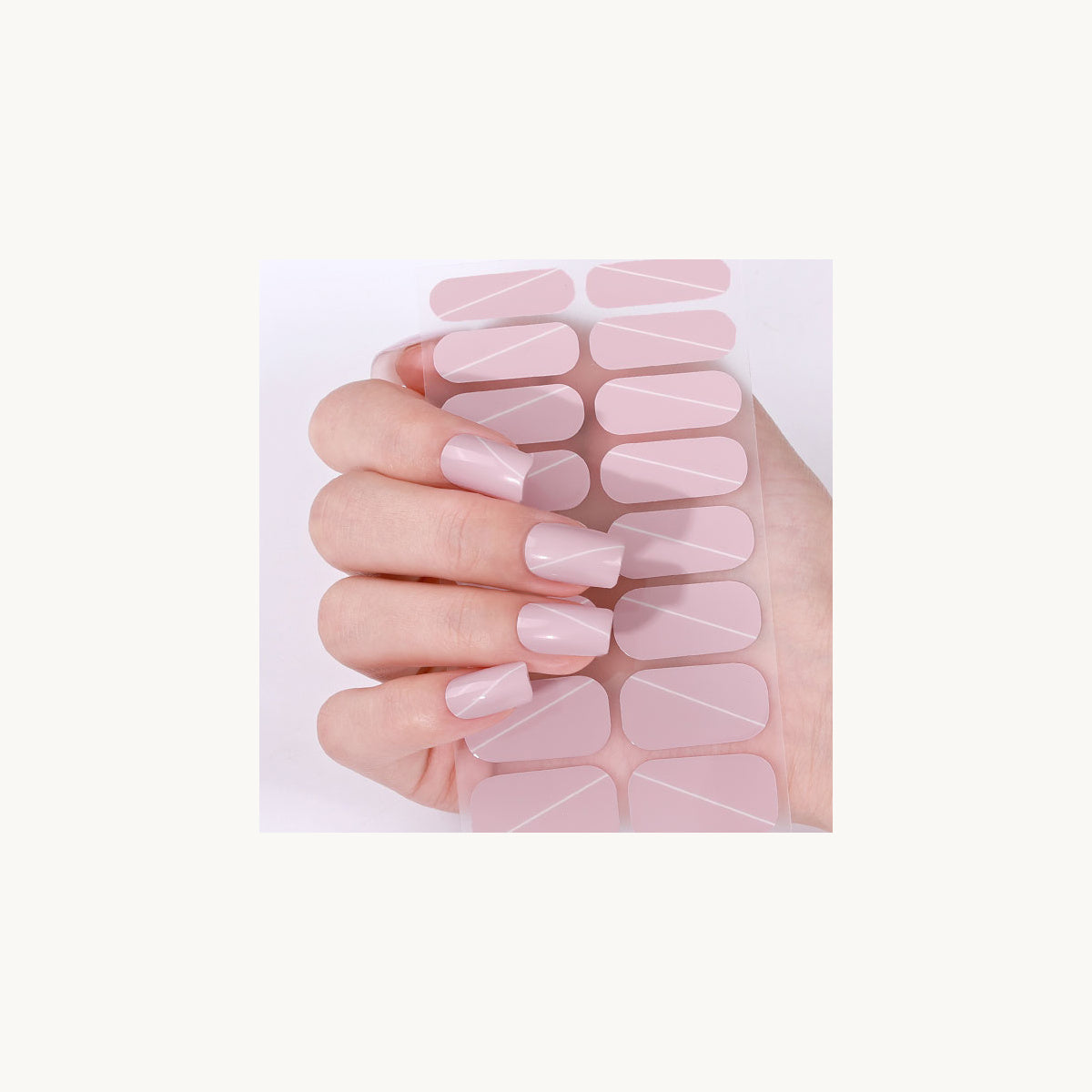 Stellia Beauty Blush Line nail wraps in a second blush pink with fine white diagonal lines manicure view