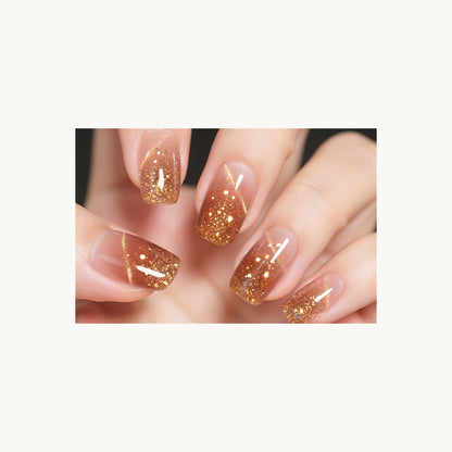 Stellia Beauty Champagne Shimmer nail wraps in a second nude with champagne-gold glitter tips manicure view