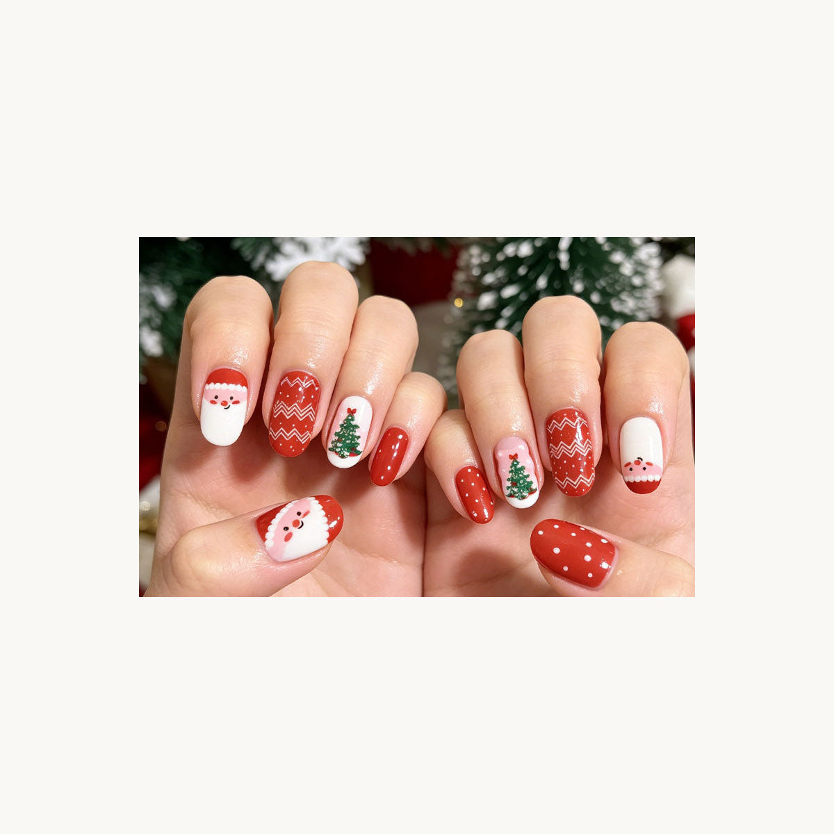 Stellia Beauty Christmas Magic nail wraps in a second red and white Christmas motifs with Santa, fair isle and a green tree manicure view