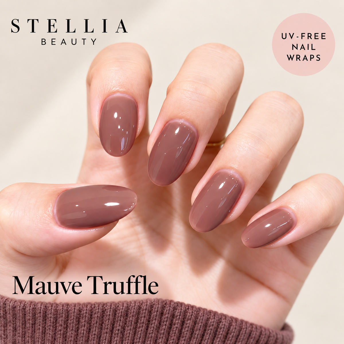 Stellia Beauty Mauve Truffle nail wraps on manicured hands in a glossy muted mauve-brown shade.