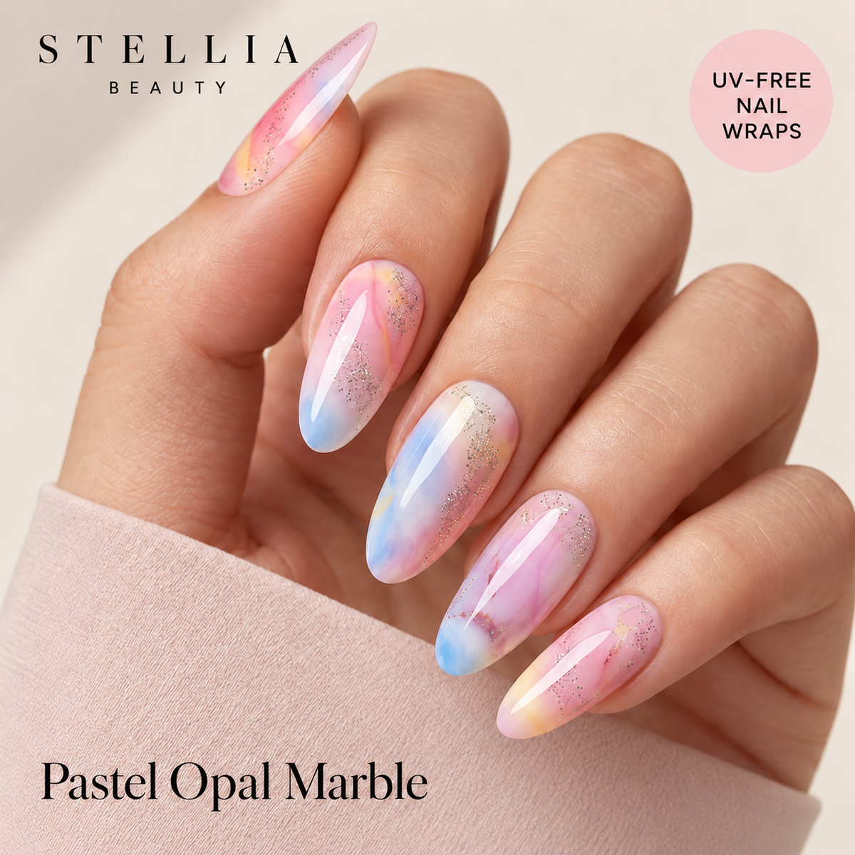 Stellia Beauty Pastel Opal Marble nail wraps on manicured hands with pink, blue and peach marbling.