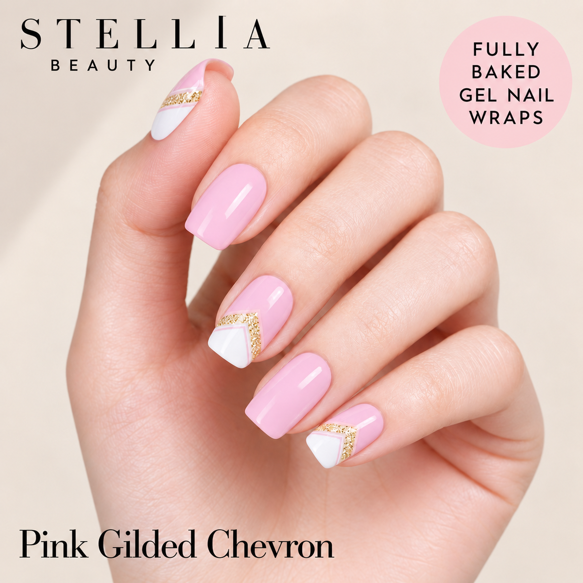 Stellia Beauty Pink Gilded Chevron fully cured gel nail wraps on manicured hands with pink, white and gold chevron accents.