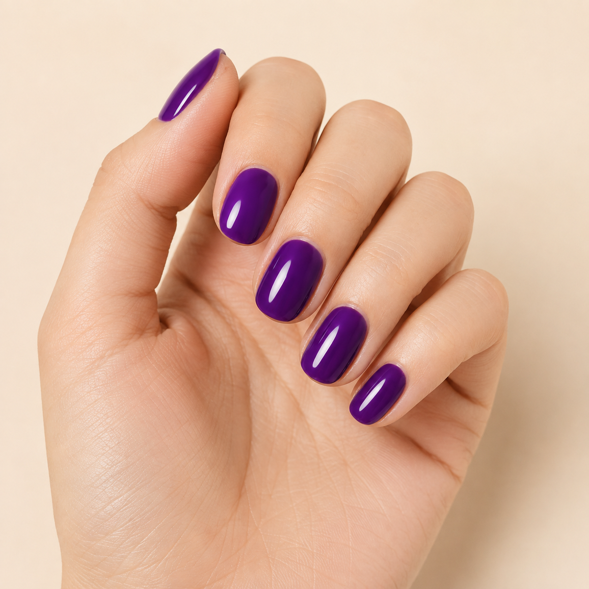 Stellia Beauty Plum Velvet nail wraps on a glossy deep purple manicure