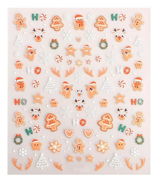 Sheet of Christmas-themed nail art stickers featuring gingerbread men, reindeer, candy canes, snowflakes, stars, and festive holiday cookie designs by Stellia Beauty